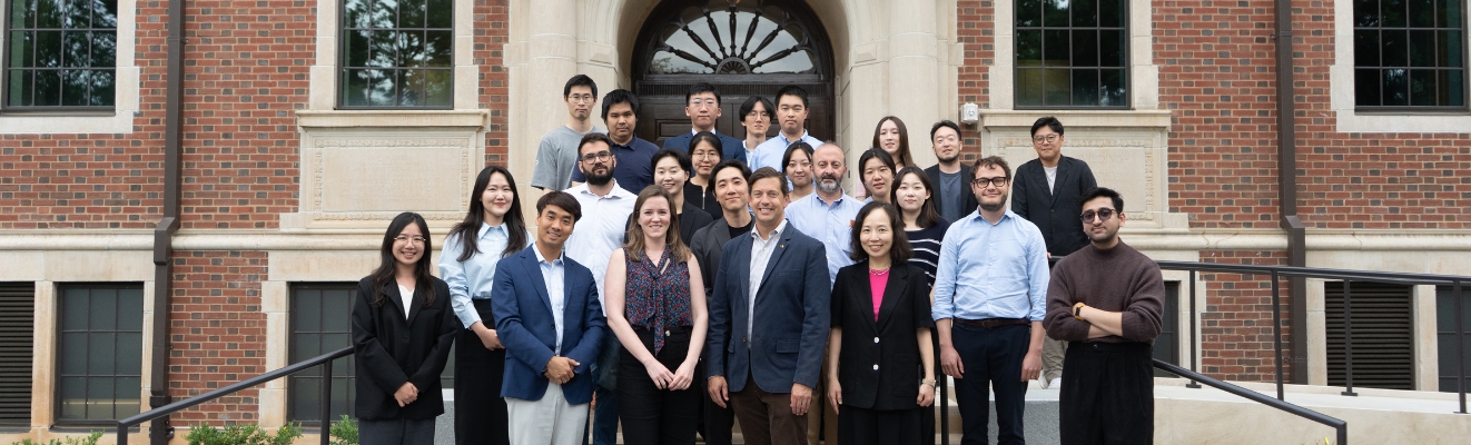 Group photo of 2026 Atlanta Academy participants and faculty standing in front of the Georgia Tech D.M. Smith Building.