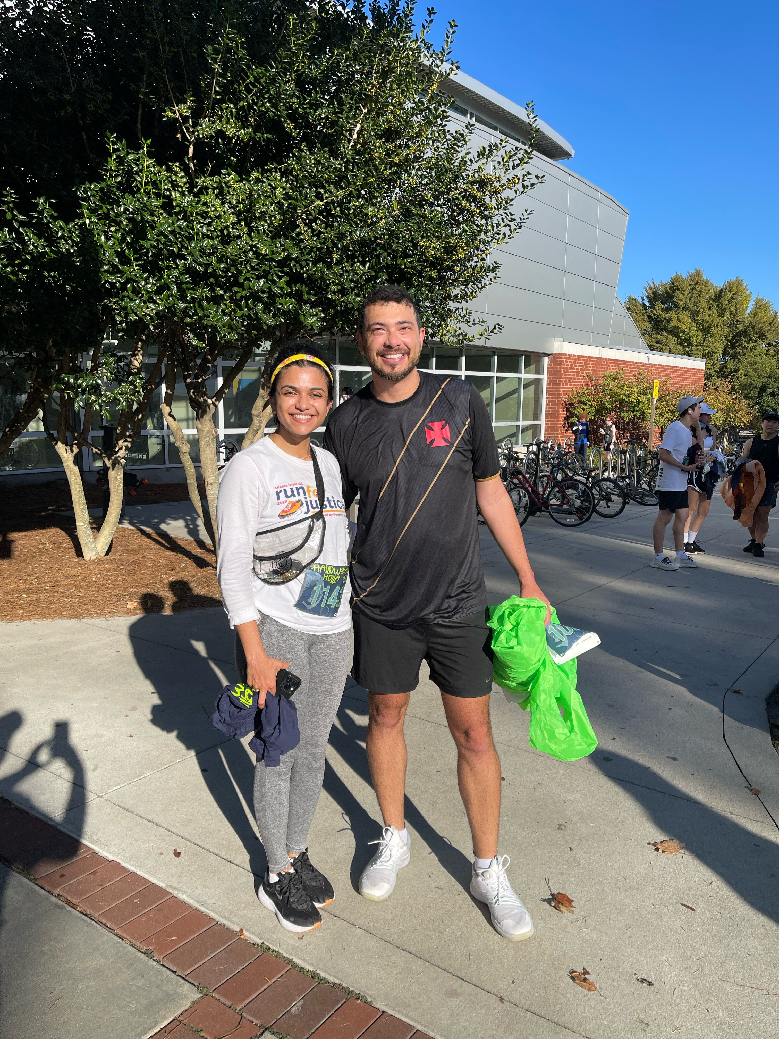 Two students pose together for a photo after running a 5k