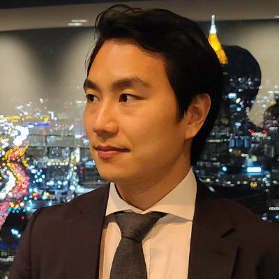 Headshot of Kyoung-cheol Kim in front of the Atlanta skyline.