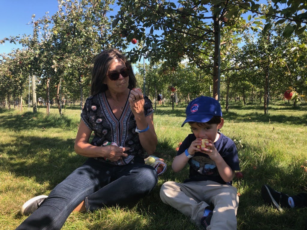 Susan outside with her child