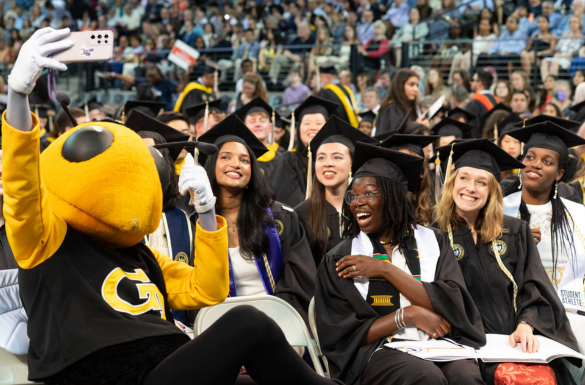 IAC graduates with Buzz at commencement