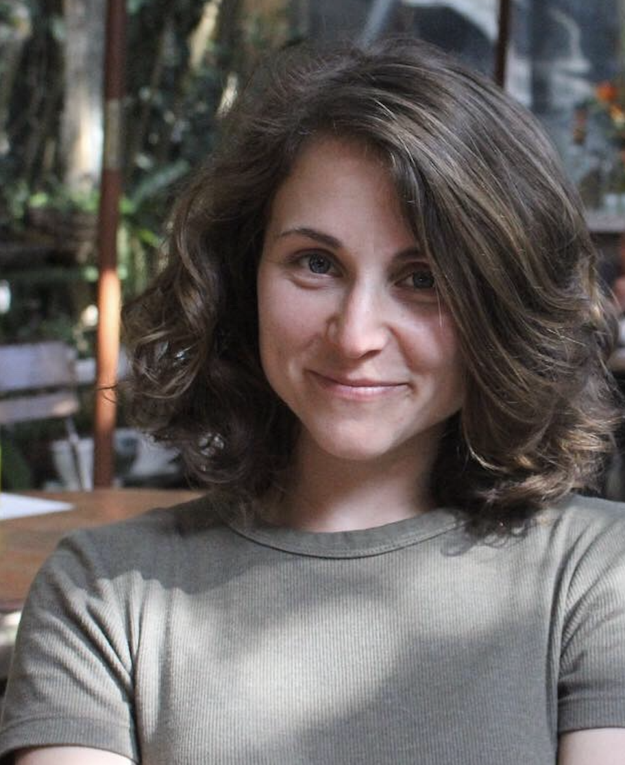 Headshot of Liza Wood sitting outside.